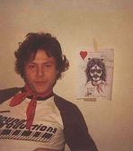 Dan Hartman himself.  The picture in the background was started by Jeff during the seesions.  On a almost daily basis, things kept being added to the sketch to turn it into the fine artwork you see before you.  Art has many forms.  Rock and Roll.